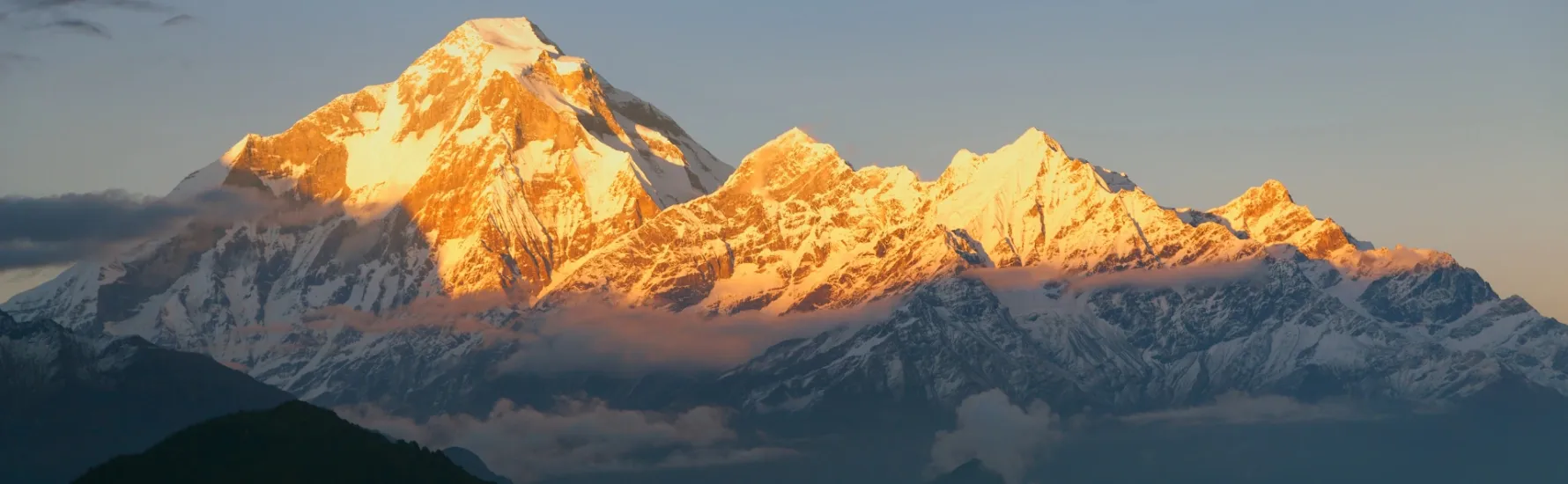 Himalayan Peaks Snow-covered mountain range with blue skies